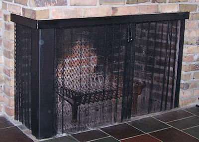 all black attached slide mesh screen on L shaped fireplace